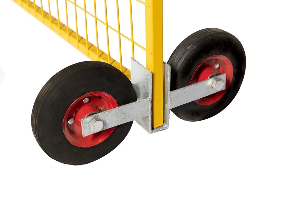 Close-up of two black rubber wheels with red hubs attached to the bottom of a yellow metal frame, isolated on a white background.