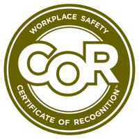 A circular olive green badge with the words Workplace Safety Certificate of Recognition surrounding the large letters COR in the center.